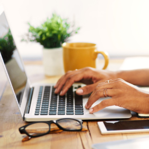 Woman typing on laptop