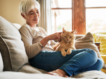 Woman on couch with cat