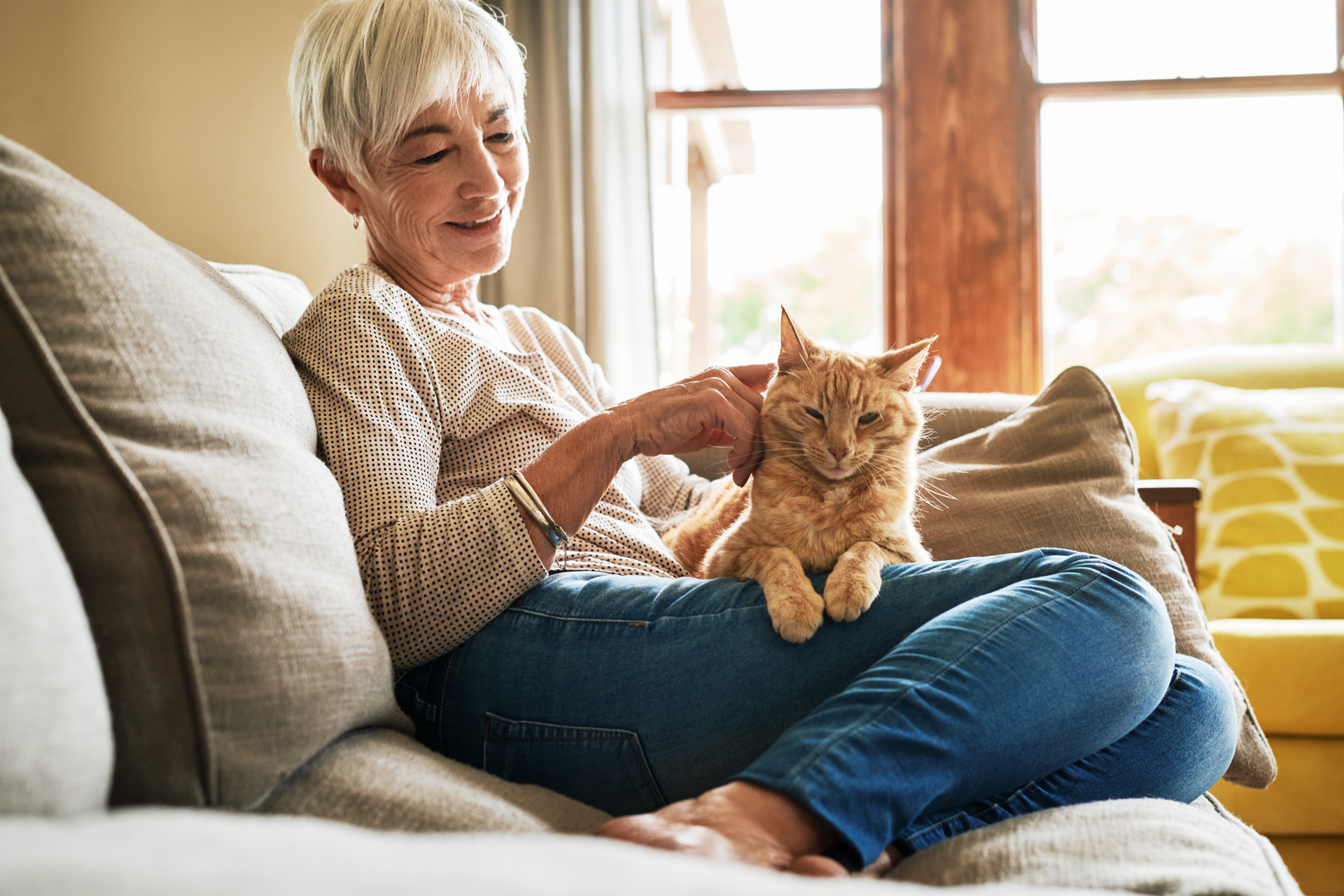 Woman on couch with cat