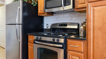 Brompton House founders collection kitchen with stainless steel gas stove