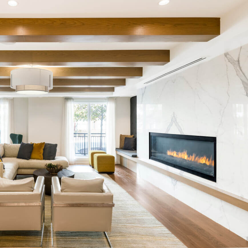 Brompton House clubroom with lounge seating and fireplace